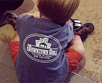 Boy wearing Downtown Grill t-shirt